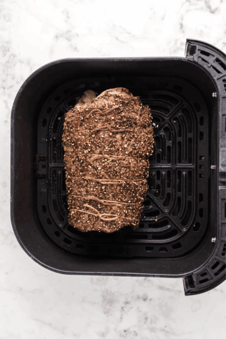 Cooked Easy Air Fryer Black and Blue Steak (Pittsburgh Style) in the air fryer basket.