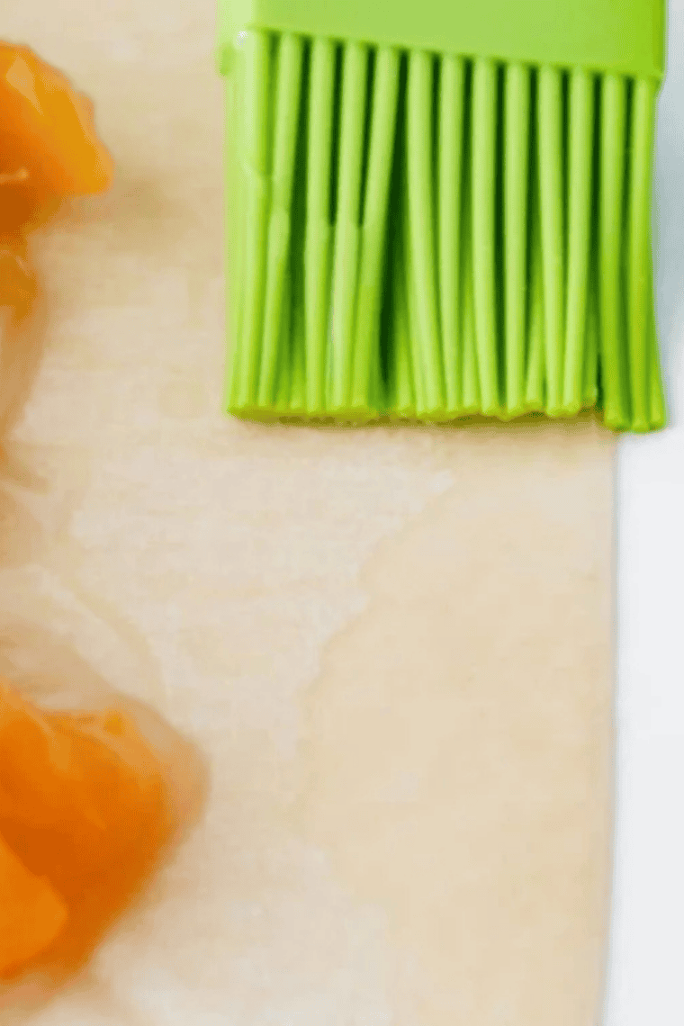 Filling placed on egg roll wrapper being folded and sealed for air fryer cooking