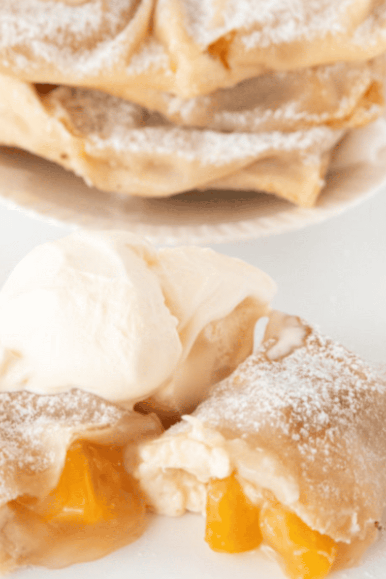 Golden, crispy air fryer peach cobbler egg rolls with creamy cinnamon-peach filling