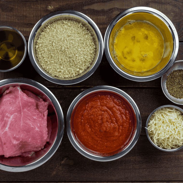 Ingredients needed for Easy Air Fryer Veal Cutlets on kitchen table.