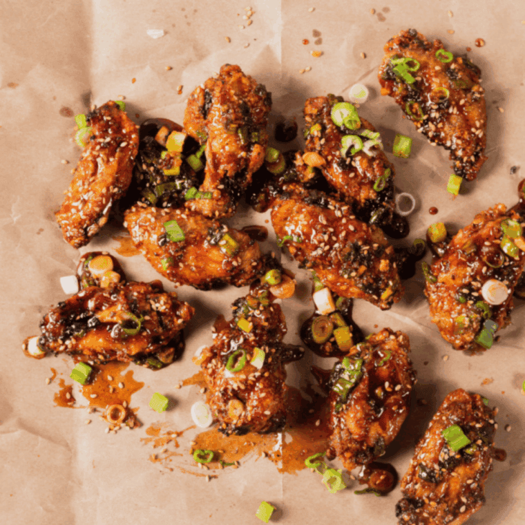 Crispy chicken wings coated in glossy Spicy Korean Q sauce.
