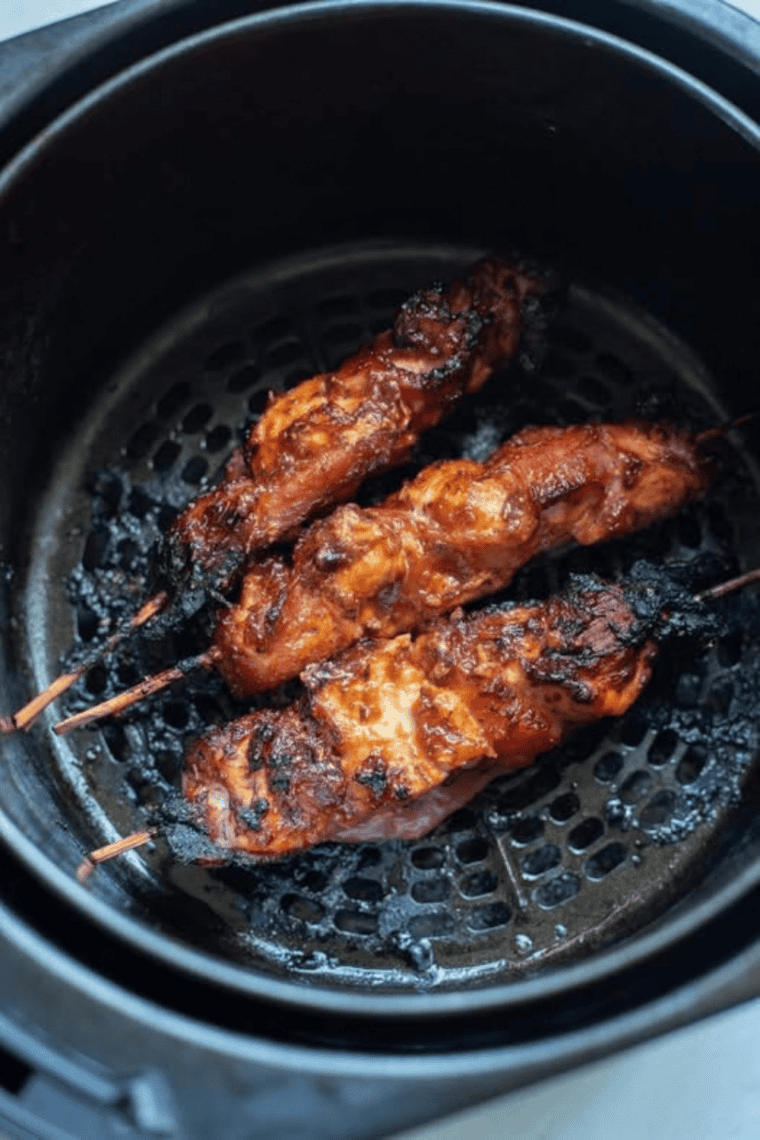 Air fryer bacon wrapped chicken tenders with a sweet and smoky brown sugar glaze