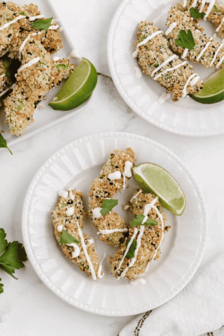 crispy golden air fryer everything bagel avocado fries served on plate with dipping sauce