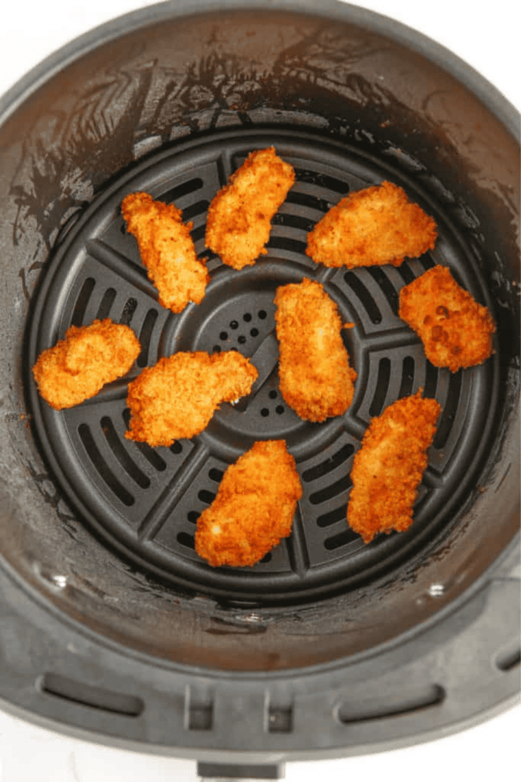 Cooked Easy Air Fryer Copycat KFC Popcorn Chicken in the air fryer basket.