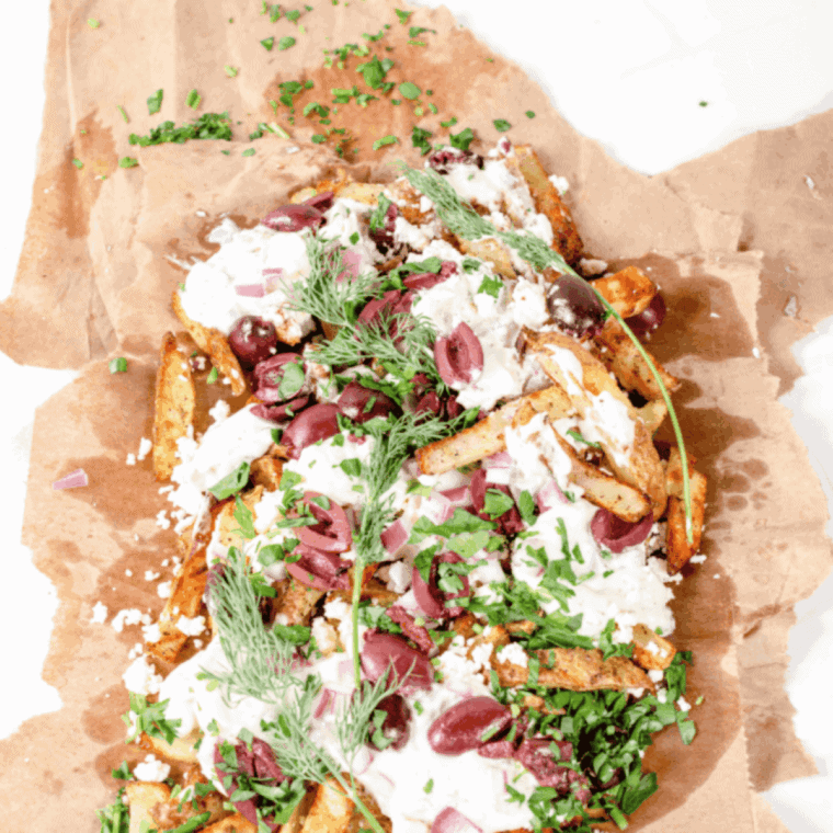 Golden, crispy air fryer Greek fries seasoned with garlic, oregano, and olive oil.