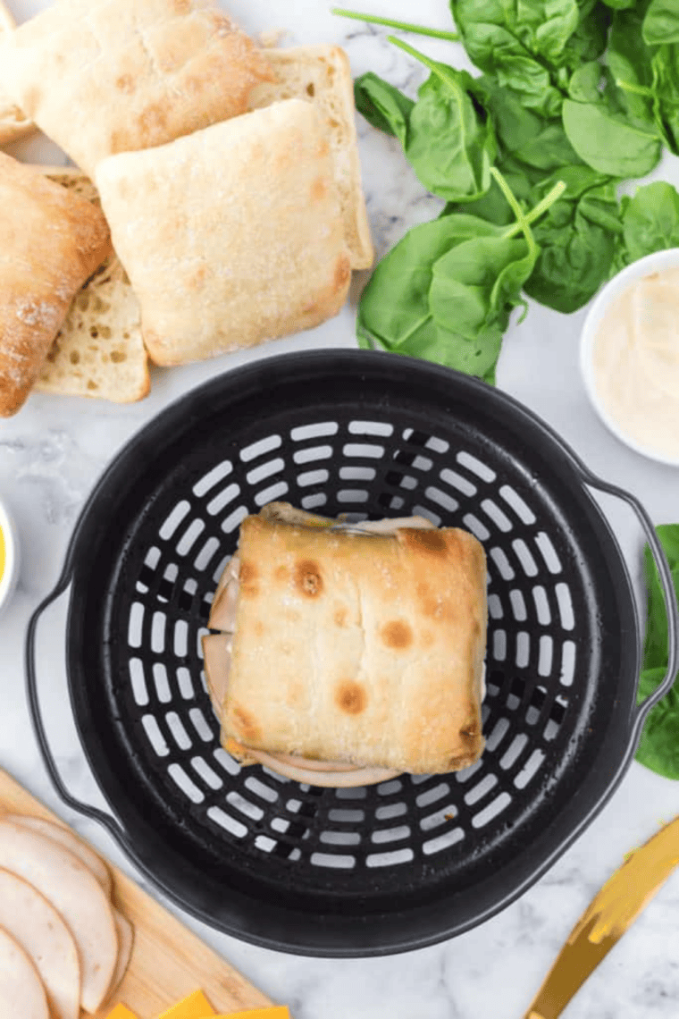 Golden air fryer turkey and cheese sandwich with melted cheddar and crispy ciabatta bread
