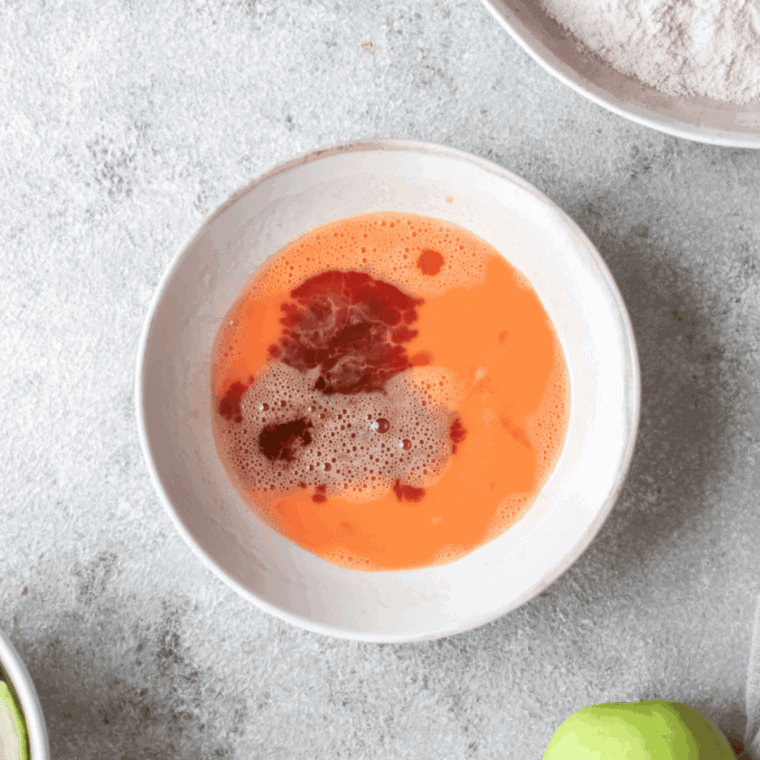 Whisked flour and apple pie spice in bowl, eggs and vanilla beaten in separate bowl.