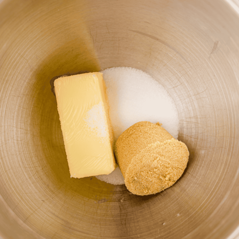 Whisking flour, quick oats, cinnamon, and nutmeg, then combining with wet ingredients in a stand mixer.