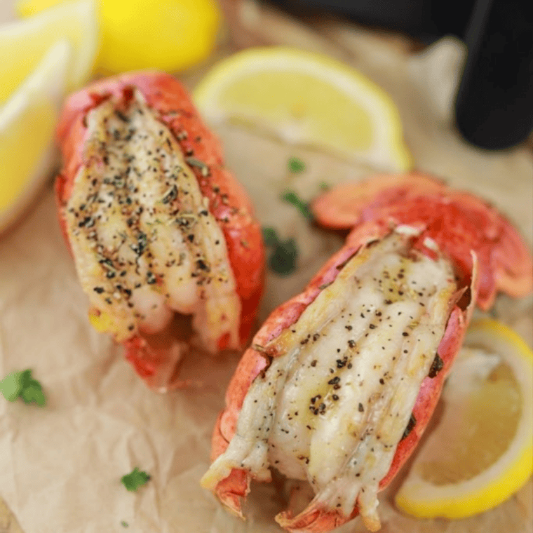 Air fryer frozen lobster tails served with garlic butter dipping sauce