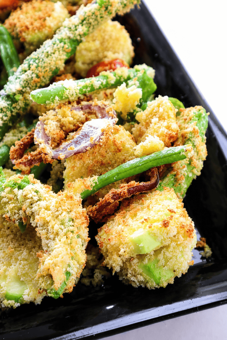 Close-up of crispy air fryer vegetable tempura on a black plate