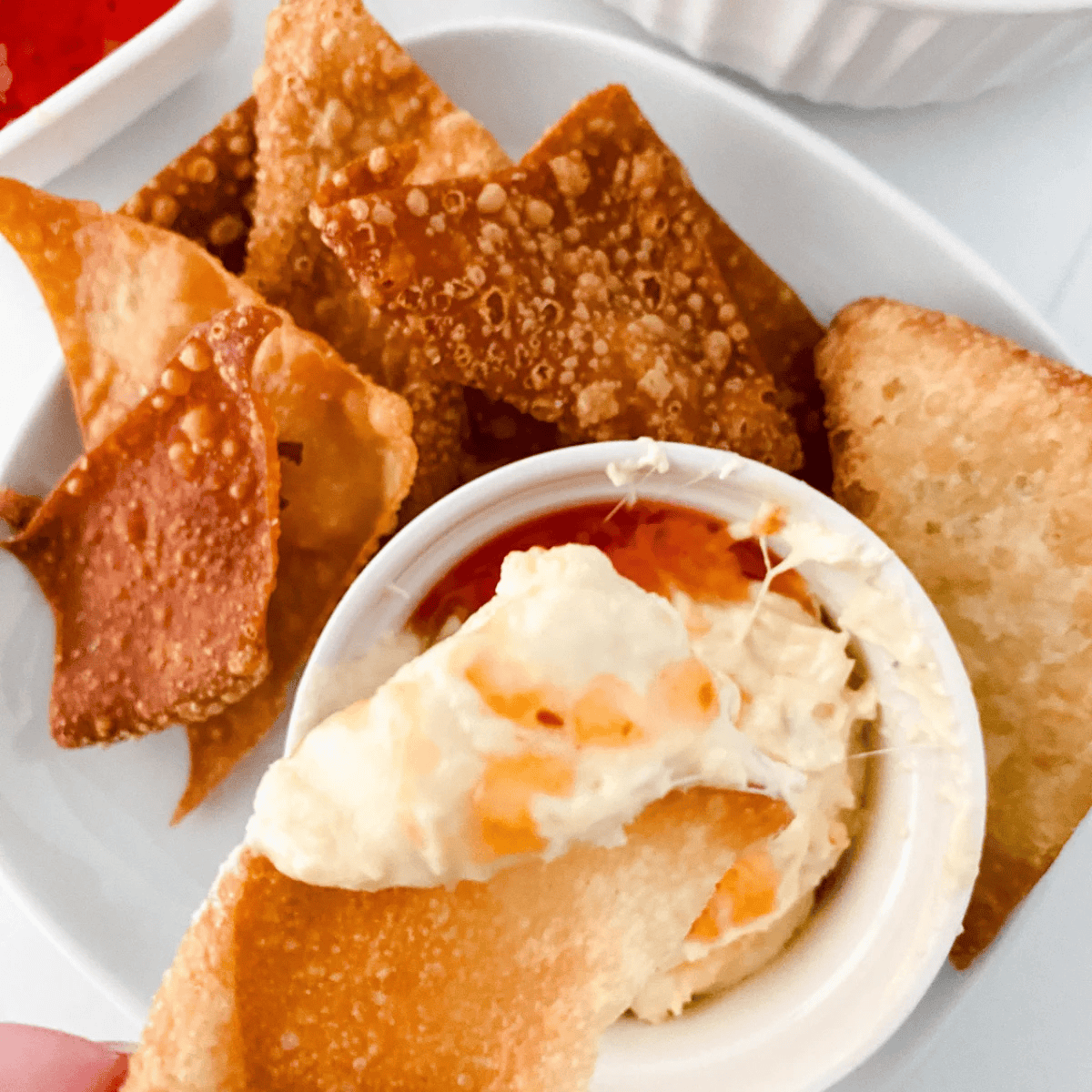 Close-up of crispy air fryer wonton chips served with salsa for dipping
