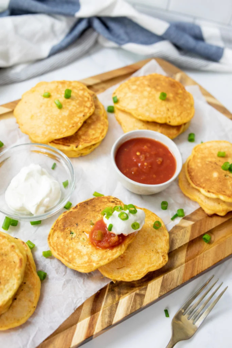 Close-up of a fluffy corn cake interior studded with sweet corn kernels.
