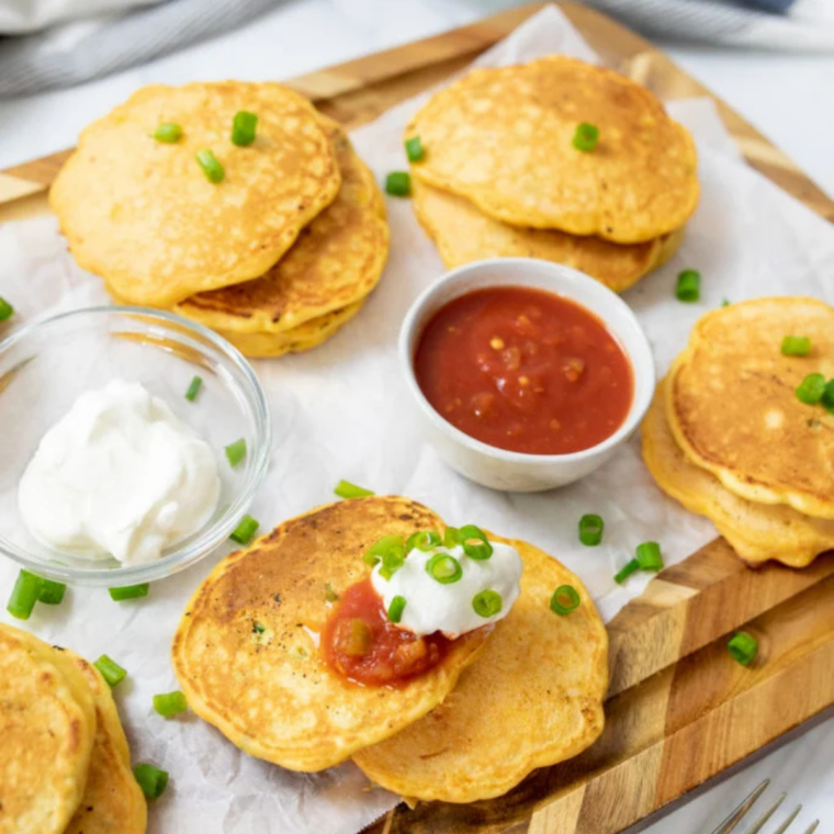 Cheesy corn cakes with melted cheddar cooked on the Blackstone griddle