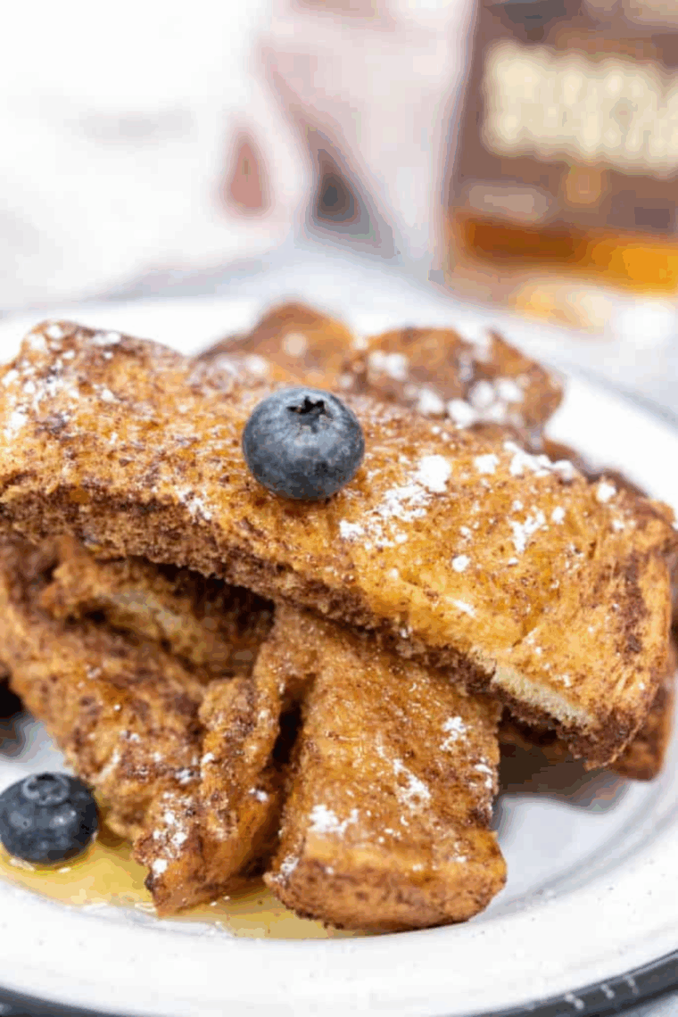 Air fryer Copycat Sonic French Toast Sticks, golden and served with maple syrup