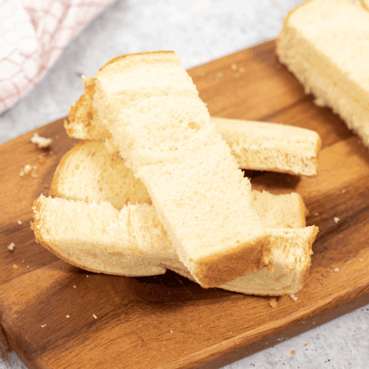 cutting thick bread slices into 1-inch French toast sticks