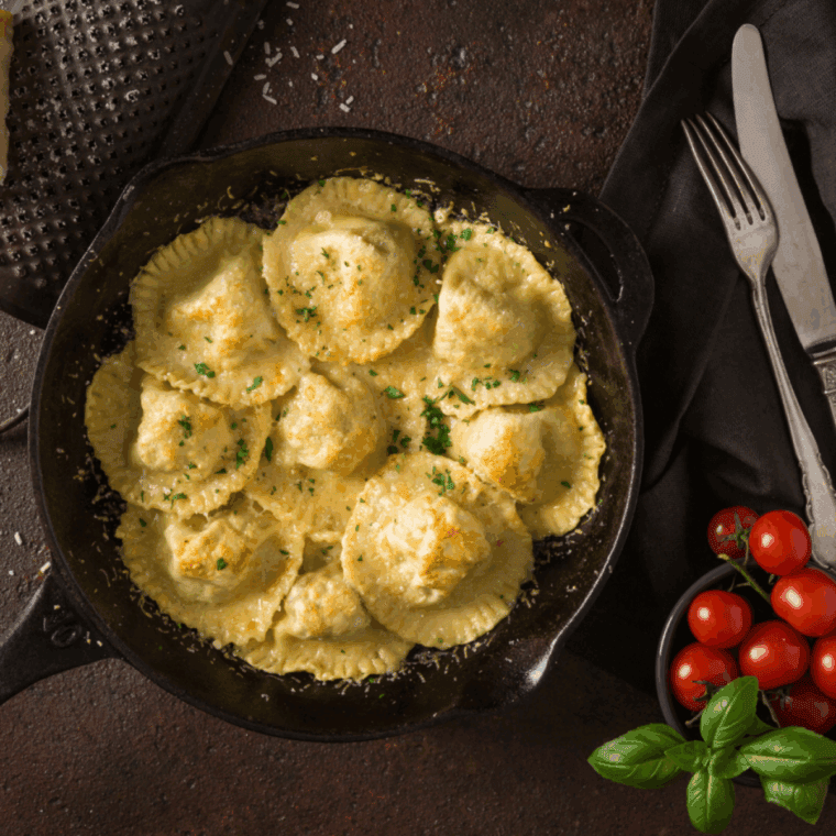 Low carb breading-free ravioli cooked crispy in the air fryer, served with dipping sauce
