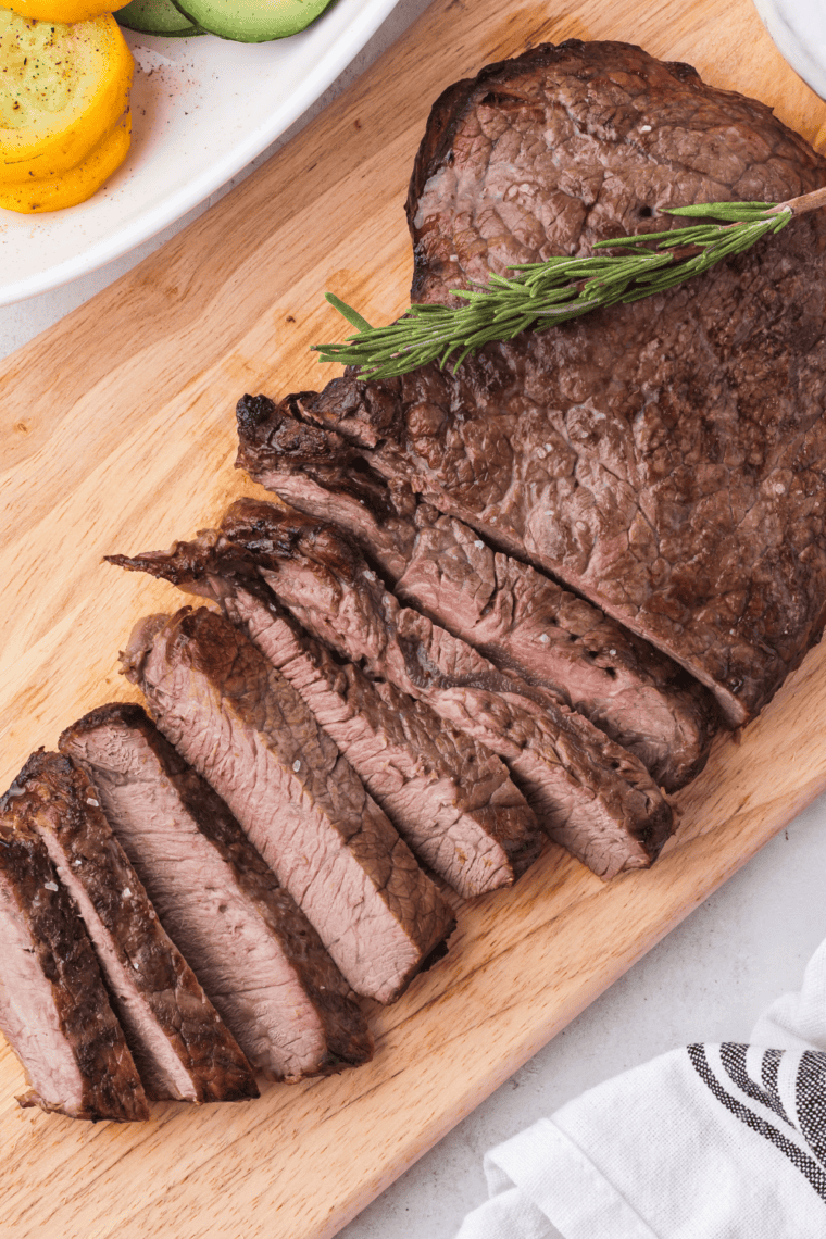 Perfectly seared Blackstone sirloin steak on a griddle, juicy and ready to serve