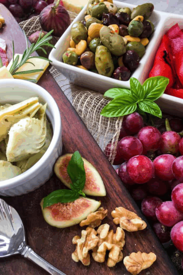 Air fryer appetizer charcuterie board featuring crispy bites, assorted cheeses, cured meats, and fresh fruits arranged on a serving platter.