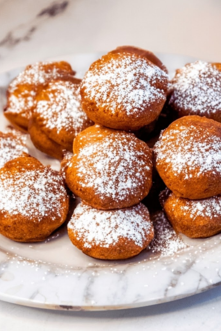 Golden Trader Joe&rsquo;s pancake puffs cooked in the air fryer and served warm with syrup