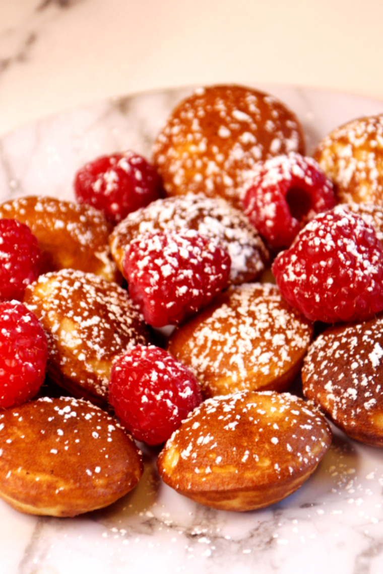 Air fryer basket filled with golden Trader Joe&rsquo;s pancake puffs fresh and fluffy