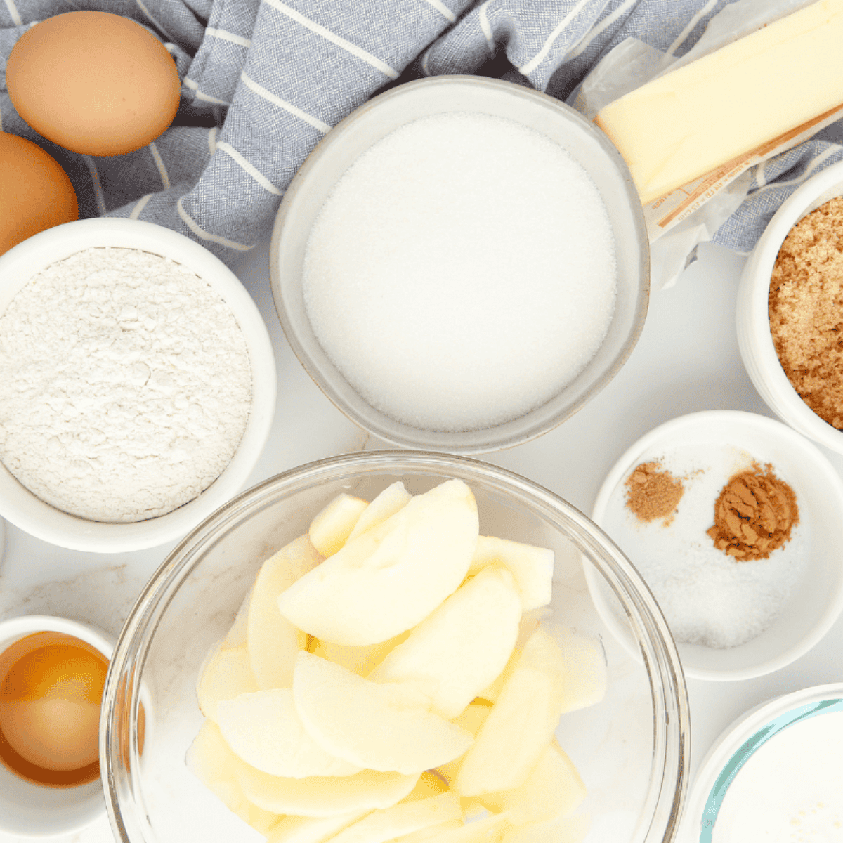 Ingredients needed for Air Fryer Upside Down Caramel Apple Cake on kitchen table.
