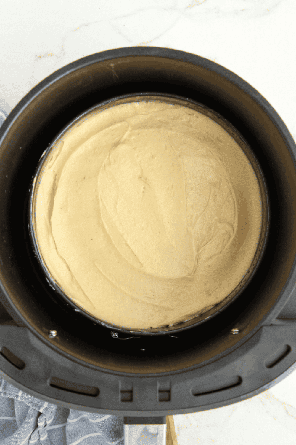 Baking upside down caramel apple cake in air fryer until fully cooked