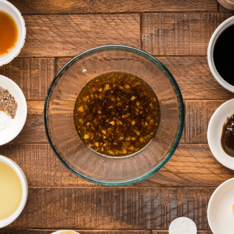 Whisking Blackstone beef kabob marinade ingredients together in a bowl