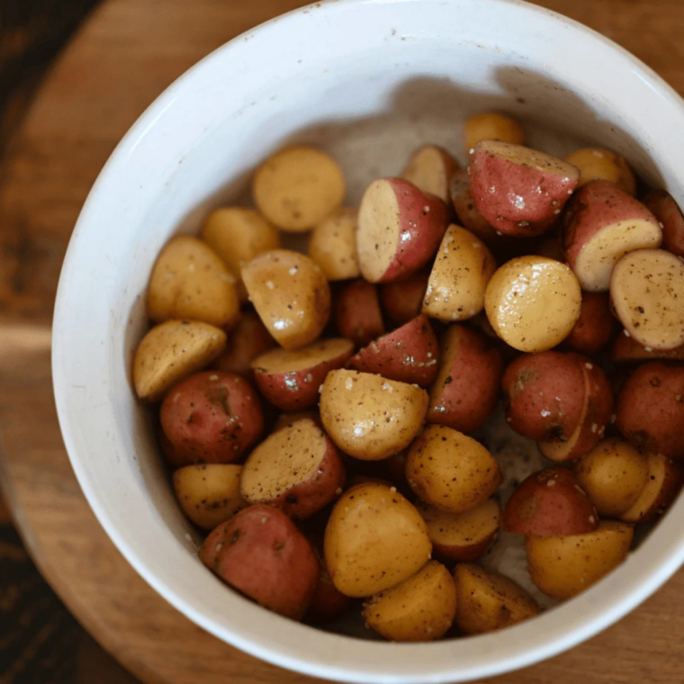 Close up of crispy griddle potatoes sizzling on Blackstone flat top grill