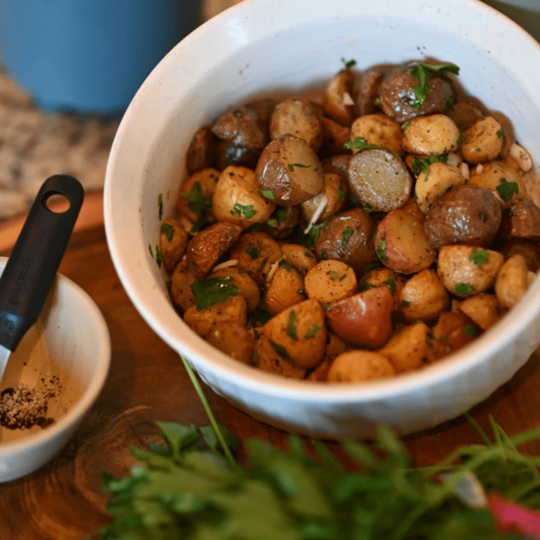 Golden crispy Blackstone griddle potatoes cooking on flat top grill
