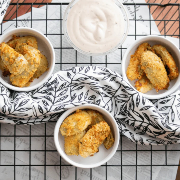 Crispy air fryer artichoke hearts fresh from the basket, steaming and golden