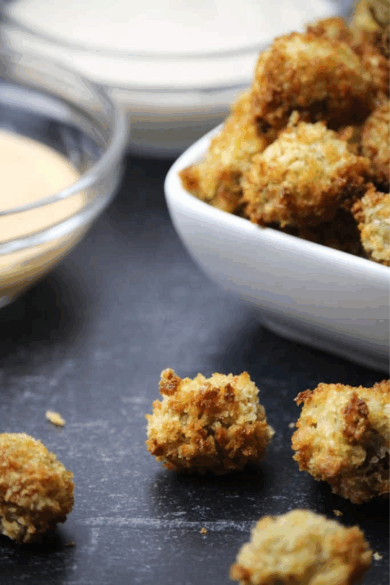 Crispy, golden-brown air fryer fried olives served in a small bowl, ready to enjoy as a snack.