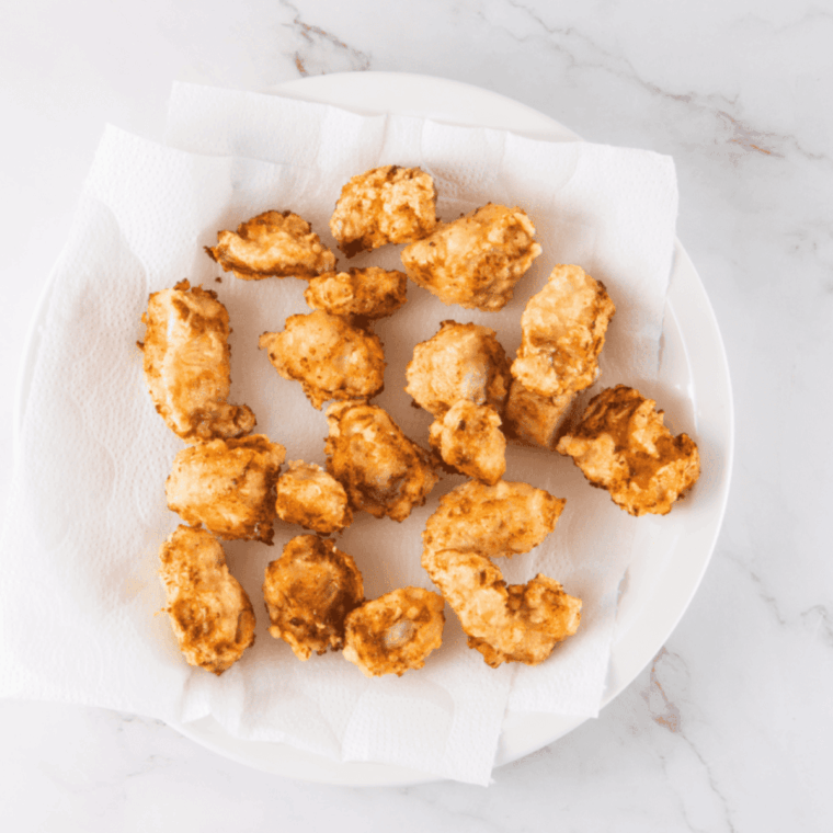 Simmering orange juice, zest, soy sauce, garlic, ginger, and spices for sauce