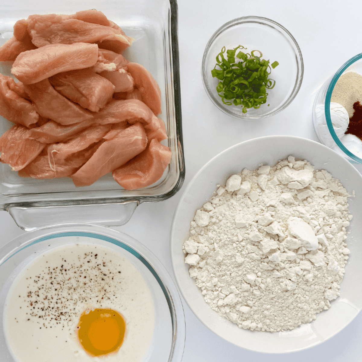 Ingredients needed for Easy Copycat Culver’s Buffalo Chicken Tenders on kitchen table.