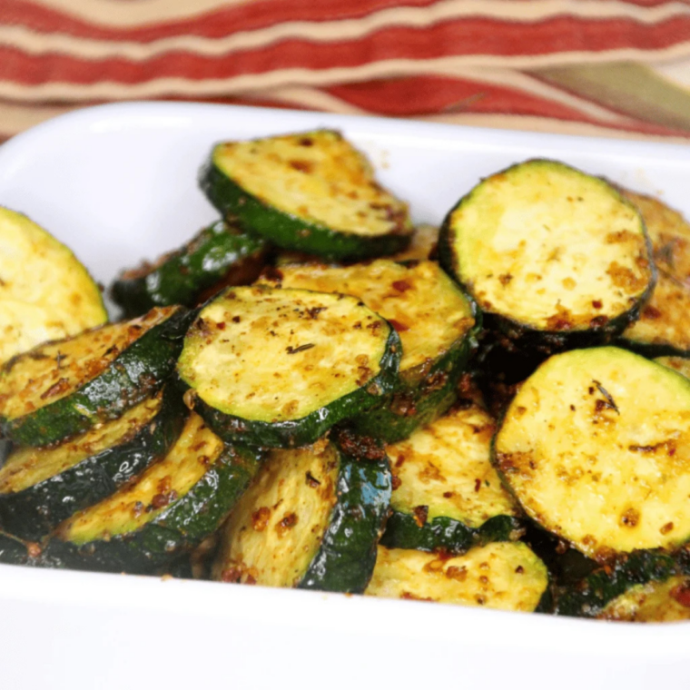 Zucchini planks on Ninja Foodi Grill with crisp grill marks and golden edges