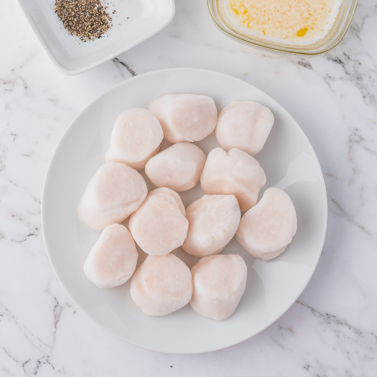 Ingredients needed for Blackstone Griddle Scallops (Perfectly Seared in 6 Minutes) on kitchen table.