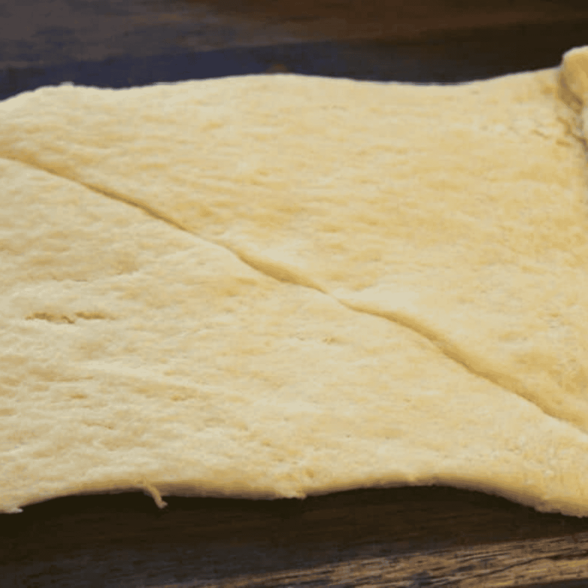 Roll out the crescent dough on a flat surface.