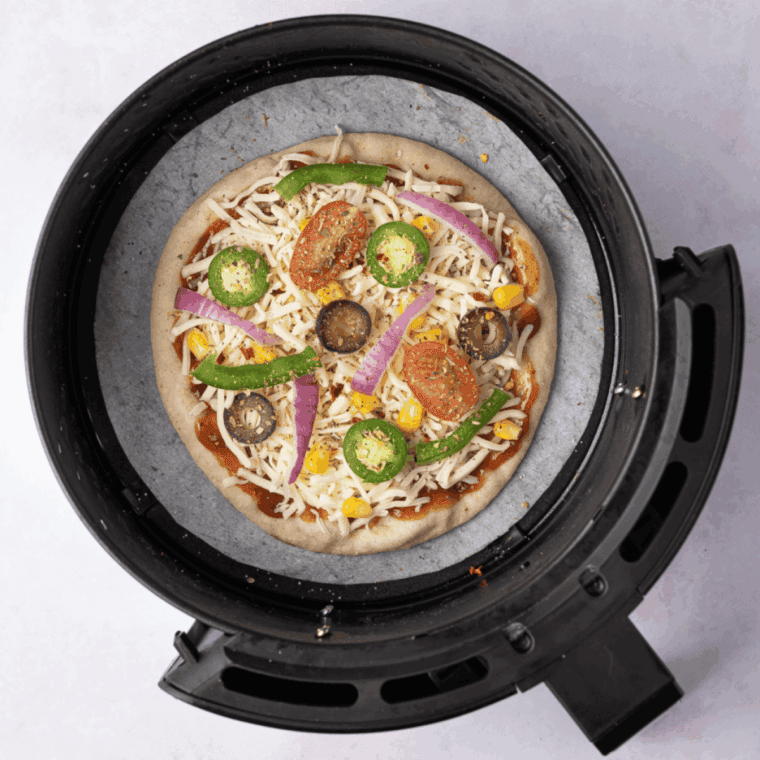Place Easy Air Fryer Weight Watchers Pita Pizza in the air fryer basket.