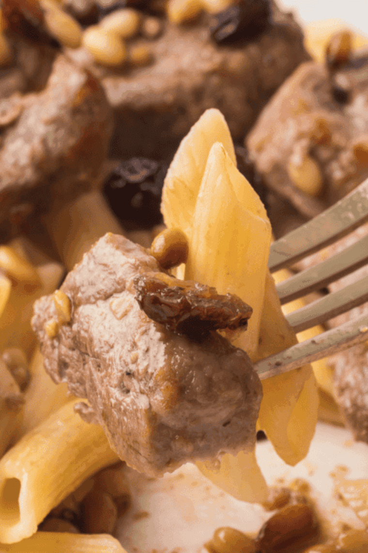 Crispy golden air fryer pork chop bites served with dipping sauce on a plate.
