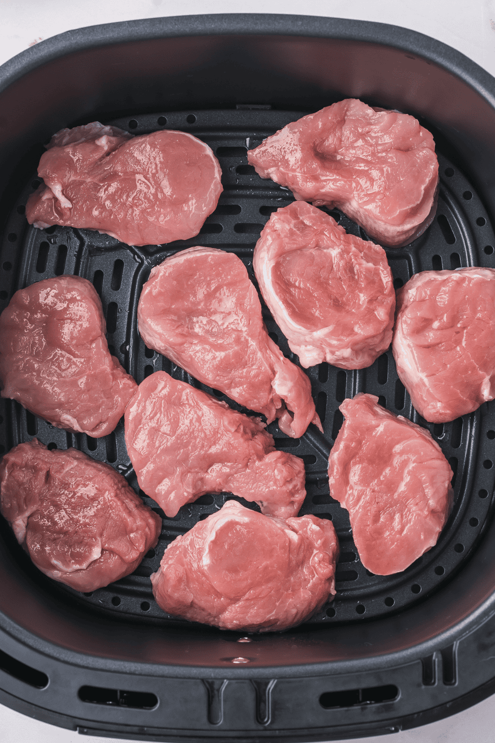 Air fryer preheating to 400&deg;F with lightly sprayed basket to prevent sticking"