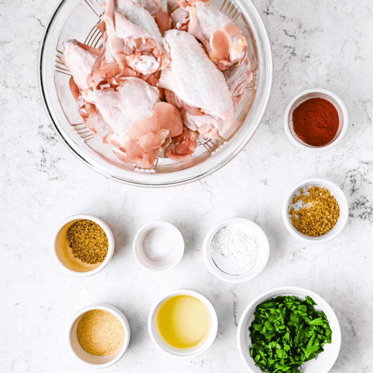 Ingredients needed for Buffalo Wild Wings Spicy Garlic Wing Recipe on kitchen table.