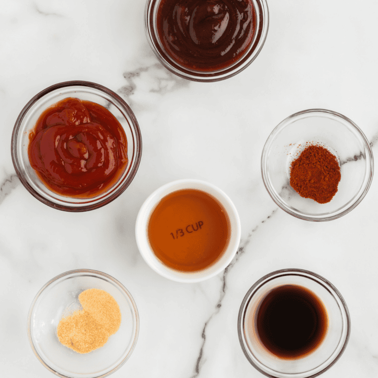 Ingredients for copycat Hooters wing sauce measured out: hot sauce, butter, vinegar, and spices