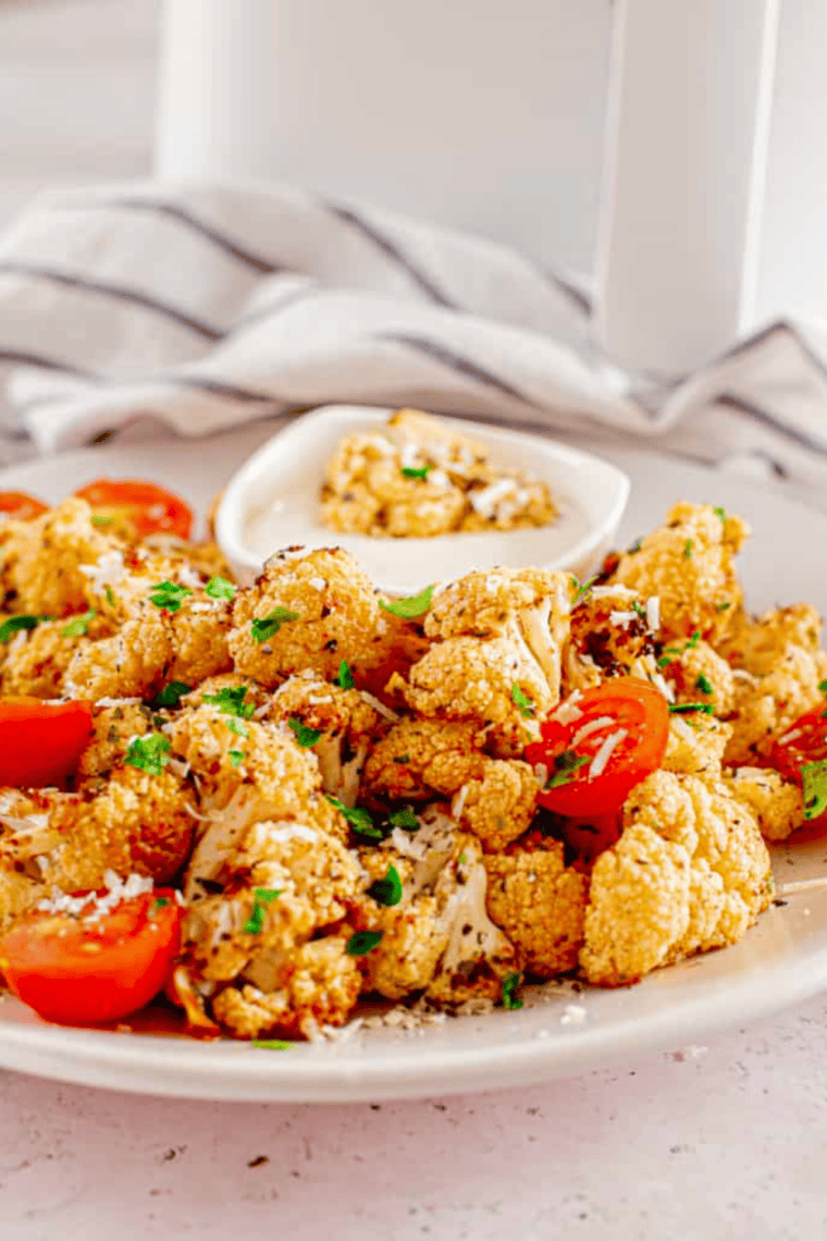 Ina Garten's Garlic-Roasted Cauliflower recipe &ndash; tender, flavorful, and easy roasted cauliflower with garlic and olive oil, perfect for a simple side dish.