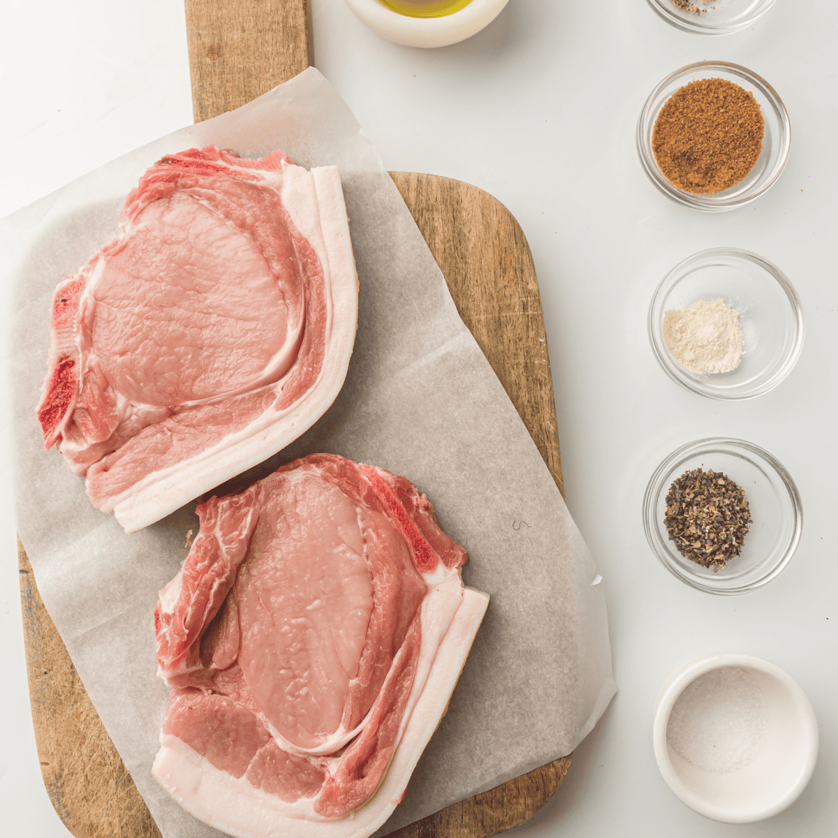 Ingredients needed for Waffle House Pork Chops Recipe on kitchen table.