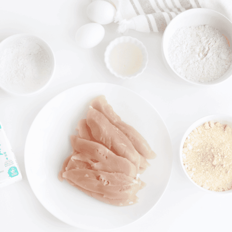 Air Fryer Copycat Bojangles Chicken Tenders ingredients on kitchen table.