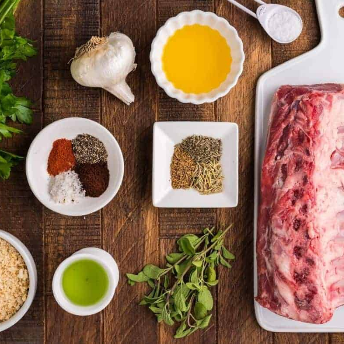 Ingredients for air fryer lamb cutlets: lamb cutlets, olive oil, garlic powder, rosemary, thyme, salt, and pepper