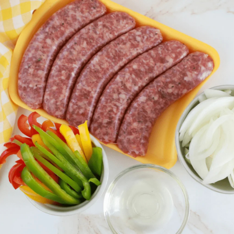 Blackstone griddle preheating to medium-high heat for cooking brats.