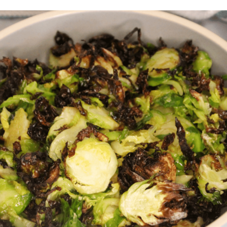 Crispy Blackstone Brussels sprouts with charred edges and tender centers served hot and ready to enjoy.