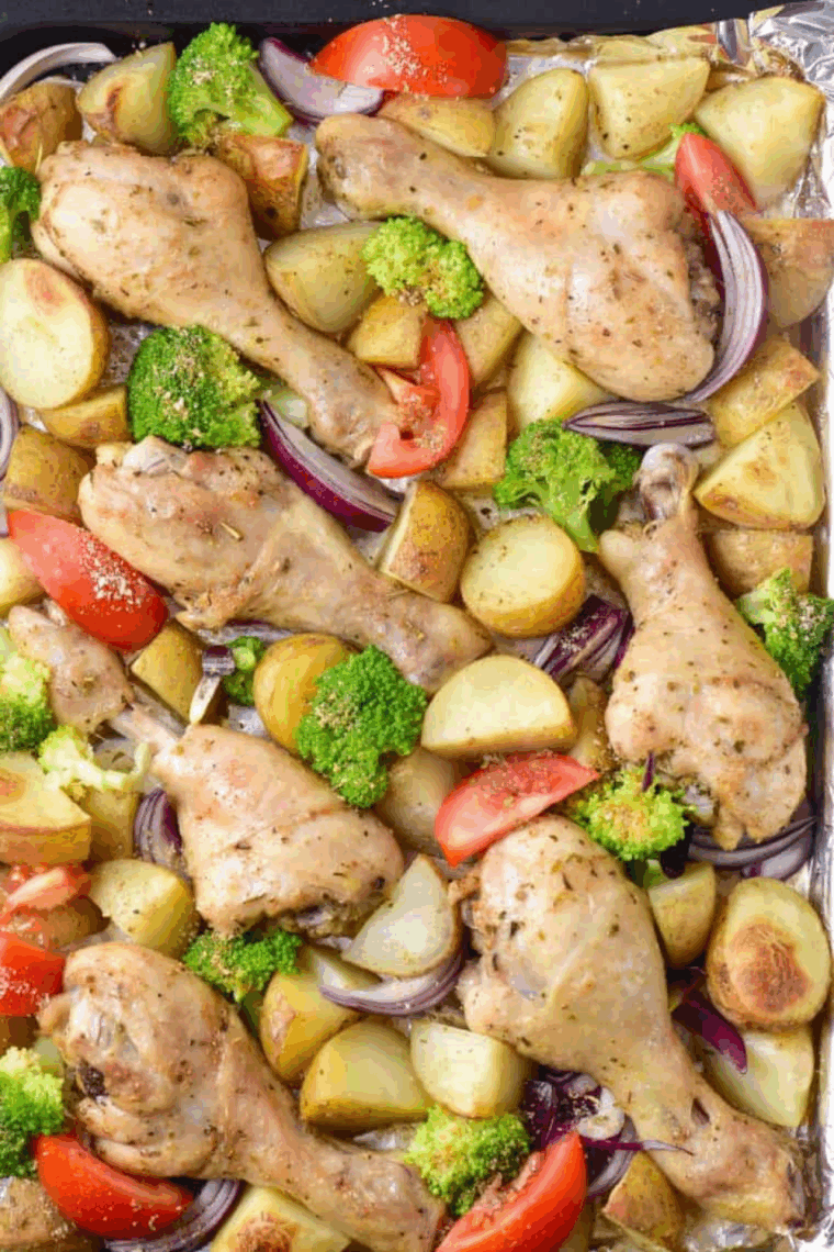 Close up of Easy Air Fryer Chicken Drumsticks with Vegetables.