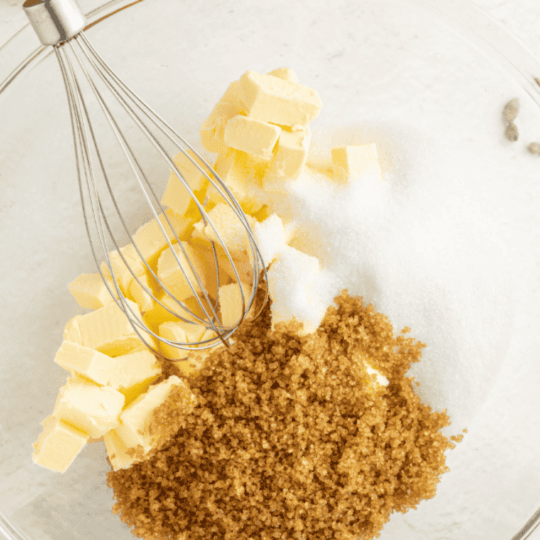 Creaming butter, oils, sugars, egg, and vanilla in a large bowl.