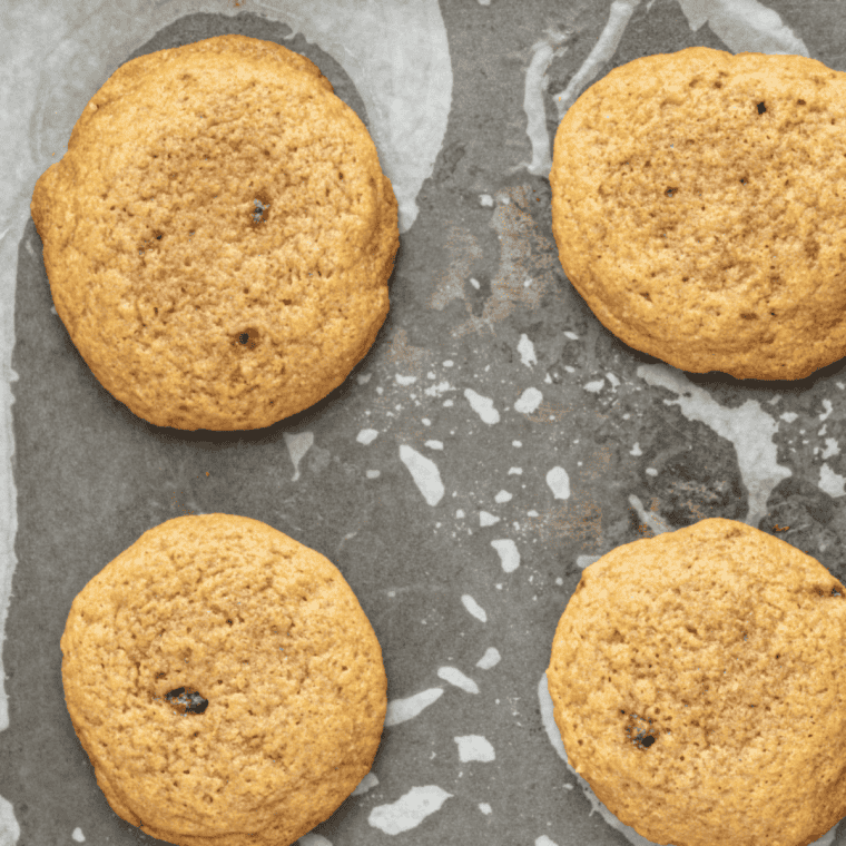 Baking cookies in the oven until edges are lightly golden.